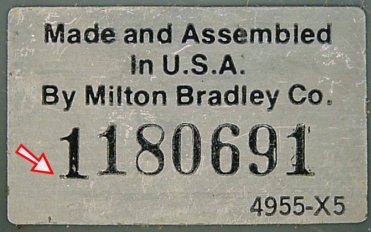 Big Trak silver-colored serial number sticker. The first '1' digit (see arrow) appears to be pre-printed.
