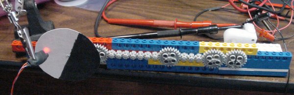 A chain of LEGO gears to simulate a loaded motor.