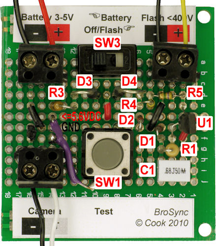 Low voltage hot shoe camera to high voltage flash hot sync adapter circuit