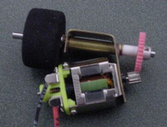 Slot car racer bracket, motor, gears, and wheel