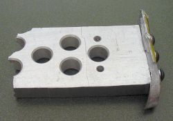 A thick piece of damaged aluminum, formerly a part of Team Saber's robot.