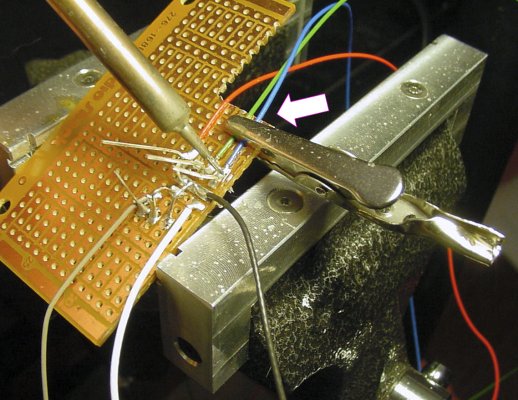 Alligator clip holds wires during soldering.