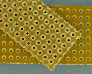 Single-sided single-pad-per-hole perfboard.