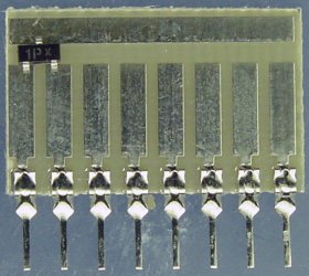 Surface mount transistor on a 6008 Surfboard.