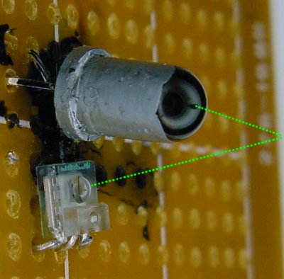 Light from an RGB LED reflects of an object and into a TAOS TSL12S-LF light-to-voltage sensor.