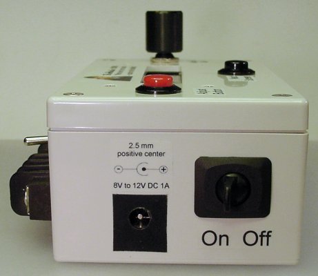 Side view of the BroMatic 2000 electronic counter showing the power plug receptacle and power switch.