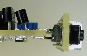 Male headers soldered onto pads allow two circuit boards to be attached at 90 degrees (perpendicular).