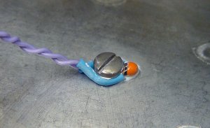 BC Components thermistor with thermal transfer heat sink compound mounted by screwing it against an aluminum case.