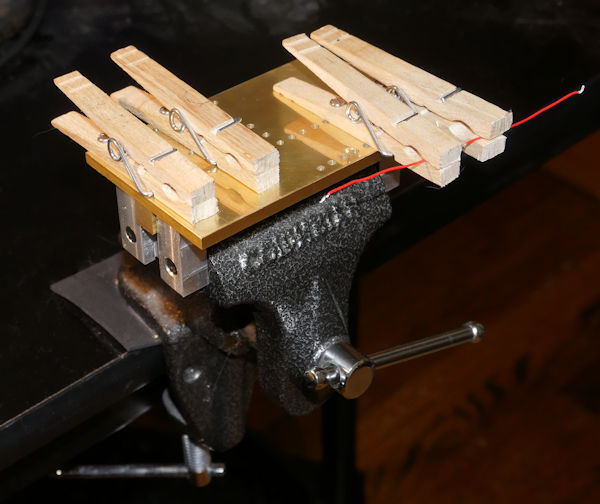 Wire soldering fixture made of clothes pins