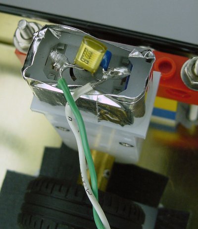 Adding capacitors across motor terminals to reduce electrical noise.