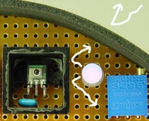 Blocking direct and ambient light with baffles improves reflective sensors.