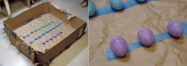 A makeshift painter’s box is made from cardboard pieces and brown Kraft paper. Plastic eggs are gently secured with low-adhesion painter’s masking tape.
