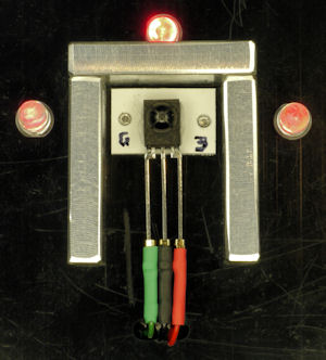 Detector with aluminum baffle surrounded by emitters