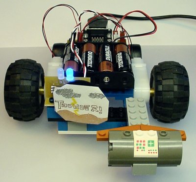 A simple joystick-controlled robot with a front-mounted power switch target (labeled Thunder!)