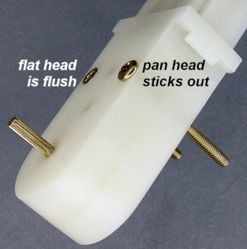 Flat head screws fit flush with the gearmotor case, but pan head screws stick out somewhat.
