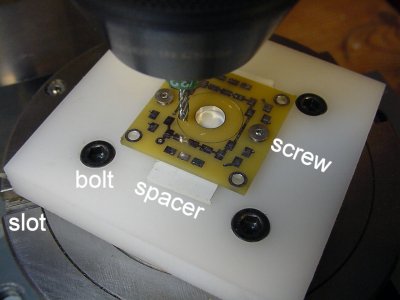 An adapter that allows a small PCB to be turned on a 4-inch rotary table.