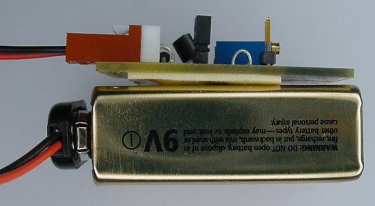 LED test PCB attached to a 9 V battery using double-sided sticky tape.