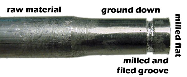 An aluminum rod showing the transition to a LEGO hub through various machining processes.
