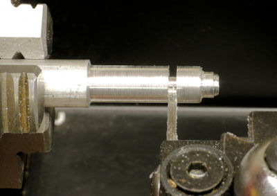 Cutting coupler from rod with a cut off blade