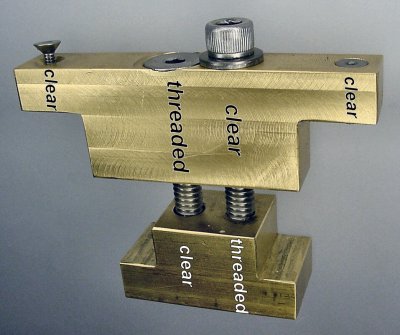 Brass carriage lock for a miniature lathe with some clear and some threaded holes