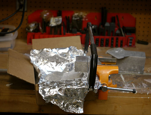 Cutting down block using a hacksaw