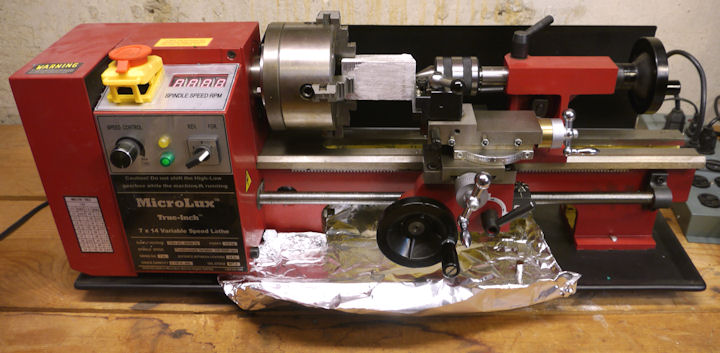 Magnesium block on 4 jaw chuck of MicroLux lathe