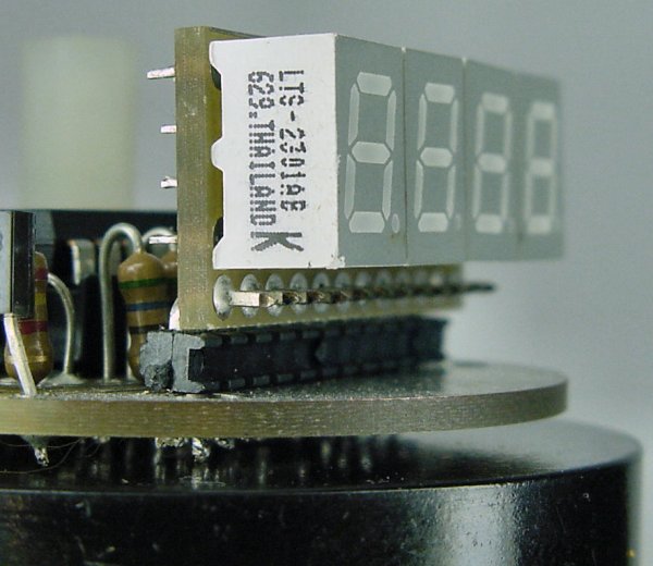 Lite-On blue numeric LEDs soldered to a daughterboard that connects to the motherboard using a strip of right-angle headers.