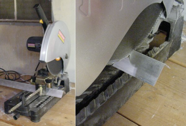 A chop saw with a metal cutting disc cuts through aluminum angle stock.