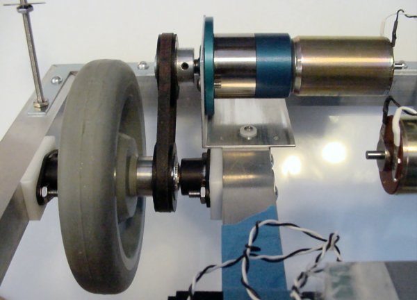 A belt-driven motor system on an aluminum frame robot.