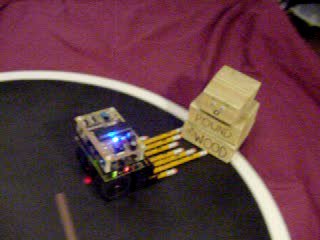 Click to see a movie of No.2 mini-sumo robot versus an inanimate block of wood.