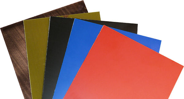 Yellowish-green (standard), black, blue, and red colored copper clad circuit board.