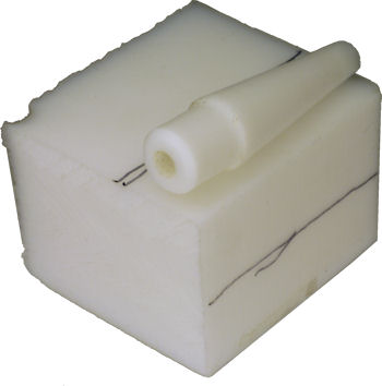 Desoldering tip on teflon block for rough cut