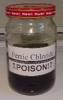 Glass jar of ferric chloride etchant
