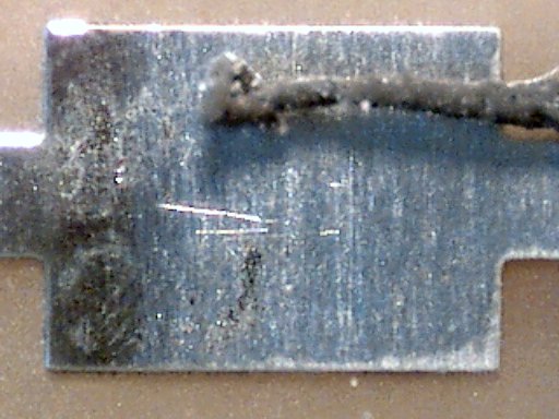 Printed circuit board pad cleaned with a Sanford Magic Rub eraser at 60x magnification.