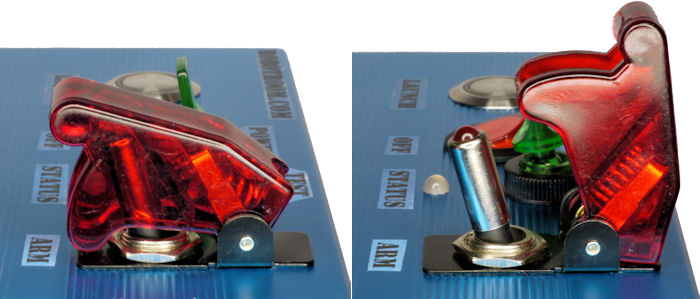 Side view of a covered toggle switch in the unarmed and ready-to-arm positions.