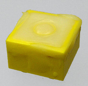 ShapeLock bonds to ABS plastic, filling in this Lego block.