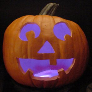 Pumpkin lit with purple LEDs instead of a candle.