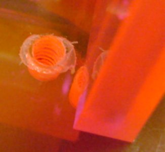 Acrylic melted on the exit of a hole drilled in the Roundabout robot. This caused the motor bracket to fit poorly until the residue was scrapped off with a razor blade.