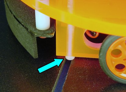 A standard socket cap screw head catches on the gap between the tiles in the ChiBots robot line-following course.