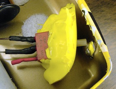 Hot-melt glue peeled off from the slippery-lined container of the Sweet robot.