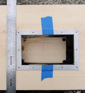 Drilling frame holes while taped in place