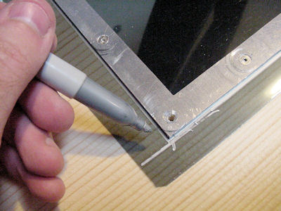 Marking edges of polarizing film before trimming