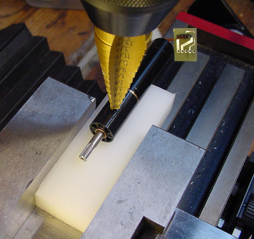 Roughly positioning drill using motor on top of plastic block