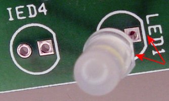 Insert an LED and or infrared emitter (IED) with the flat side (cathode) of the package matching the flat side of the silkscreen outline