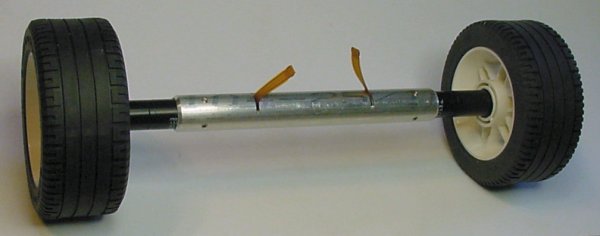 Tall Lego wheels, narrow Maxon motors, a narrow aluminum tube axle, and thin motor cables constructed for a robot with a high ground clearance.