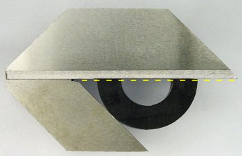 Finding the center of the plastic ring with a center square tool.