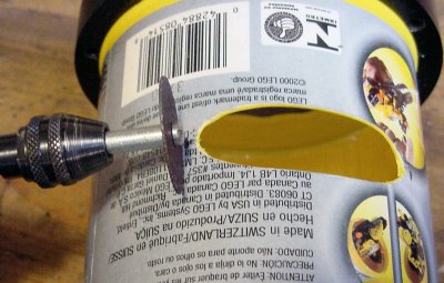 Making slits for the flat motor cables using a Dremel with a cut-off wheel.