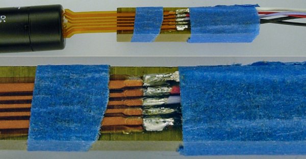 Individual wires soldered to a flat flex cable.