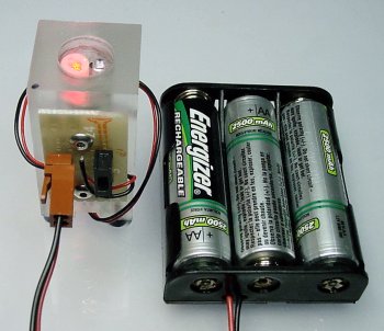 A laser module in a plastic block with an external power switch and Energizer battery pack.