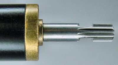 A motor shaft machined to have double flats.